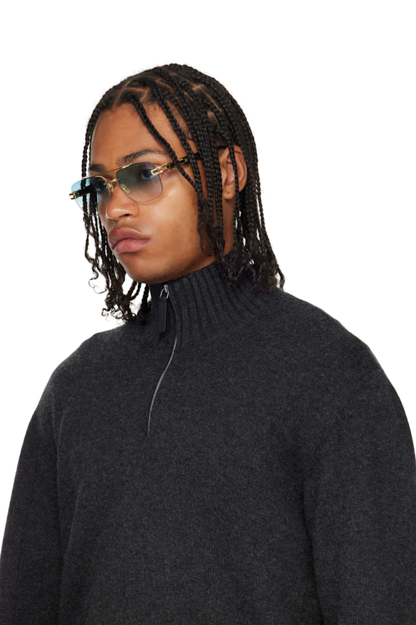 Handcrafted and aviator-style rimless titanium- and acetate-frame sunglasses. 

· Anti-reflective CR-39 blue lenses
· Logo etched at lens 
· 100% UVA/UVB protection
· Top bar 
· Adjustable metal nose pads
· Fluted detailing at temples
· Inset logo at temple tip
· Includes case
· Size: 57.16 145

Available exclusively at SSENSE.

Supplier color: Black/Gold