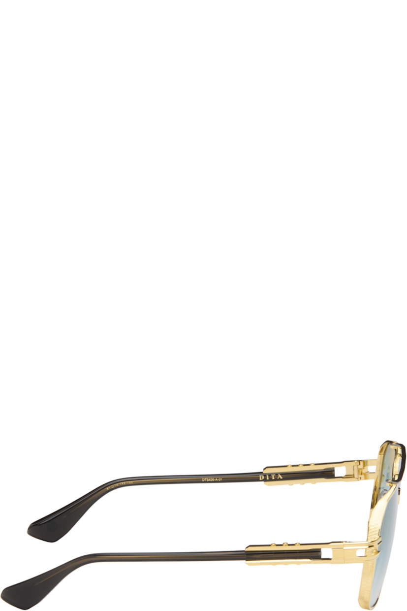Handcrafted aviator-style titanium-frame sunglasses.

· Anti-reflective CR-39 blue lenses 
· Logo etched at lens 
· 100% UVA/UVB protection 
· Adjustable metal nose pads
· Double bridge 
· Fluted detailing at temples
· Black acetate temple tips 
· Includes case 
· Size: 61.14 145-155

Available exclusively at SSENSE.

Supplier color: Yellow gold