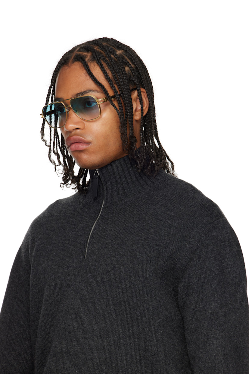 Handcrafted aviator-style titanium-frame sunglasses.

· Anti-reflective CR-39 blue lenses 
· Logo etched at lens 
· 100% UVA/UVB protection 
· Adjustable metal nose pads
· Double bridge 
· Fluted detailing at temples
· Black acetate temple tips 
· Includes case 
· Size: 61.14 145-155

Available exclusively at SSENSE.

Supplier color: Yellow gold
