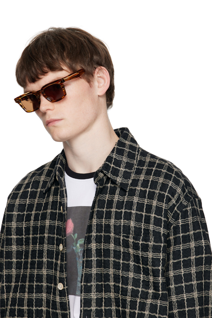 Square semi-transparent tortoiseshell acetate-frame sunglasses.

· Handcrafted
· Logo etched at lens
· Anti-reflective CR-39 brown lenses
· 100% UVA/UVB protection
· Integrated nose pads
· Core wire at temples
· Inset logo at temple tips
· Includes case
· Size: 50.22 148

Supplier color: Brown hazel