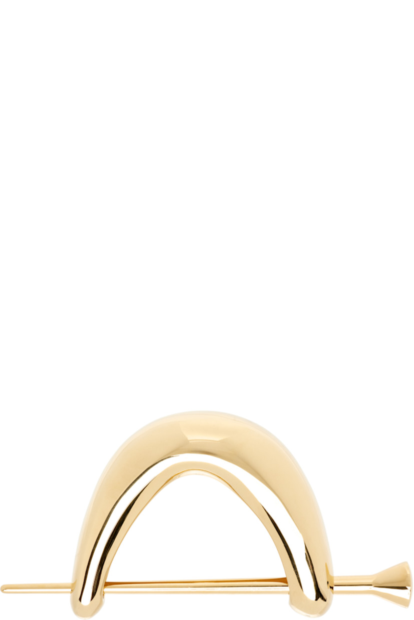 Hair pin in 18k yellow gold-plated sterling silver.

H1.5" x W3"

Supplier color: Yellow gold