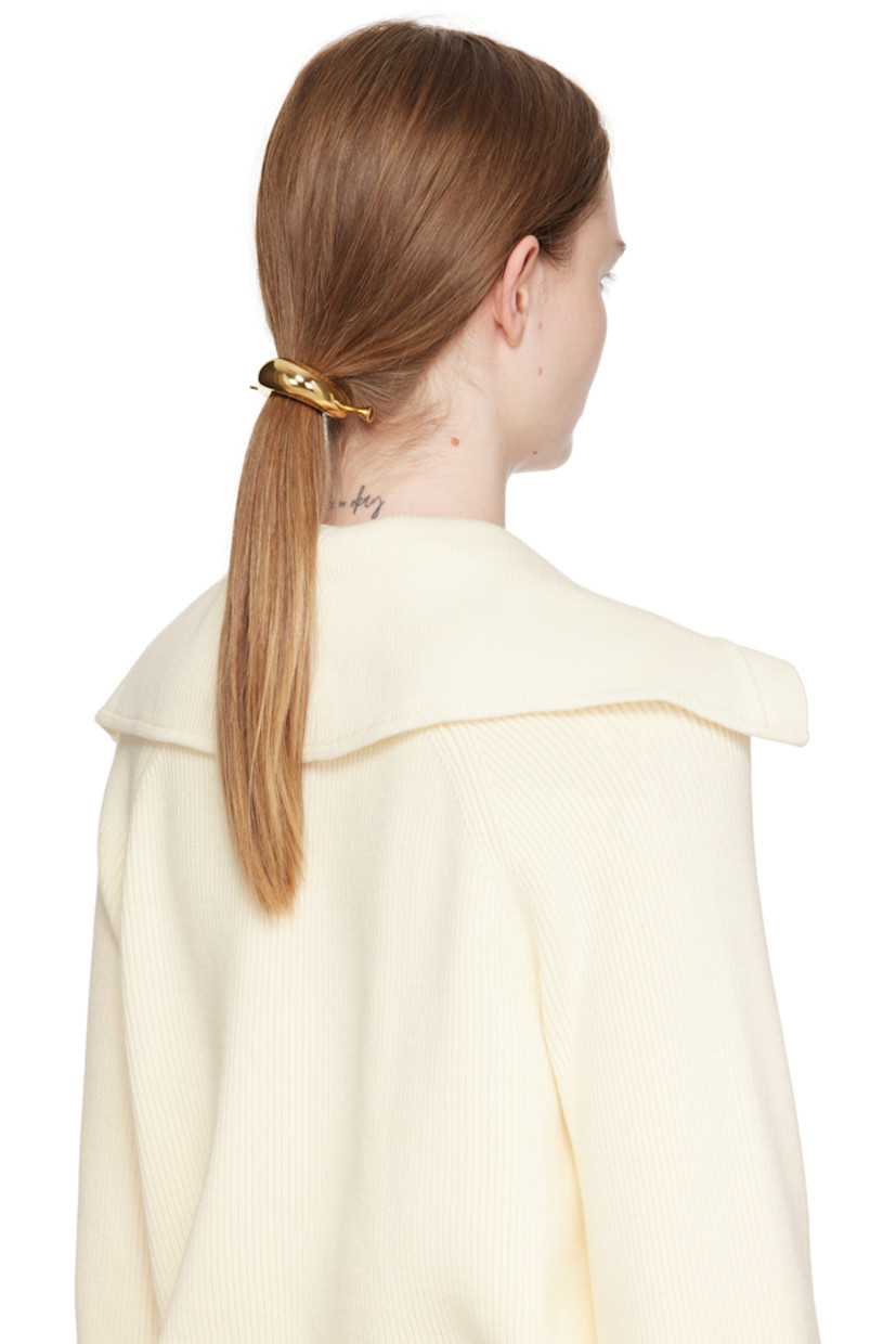 Hair pin in 18k yellow gold-plated sterling silver.

H1.5" x W3"

Supplier color: Yellow gold
