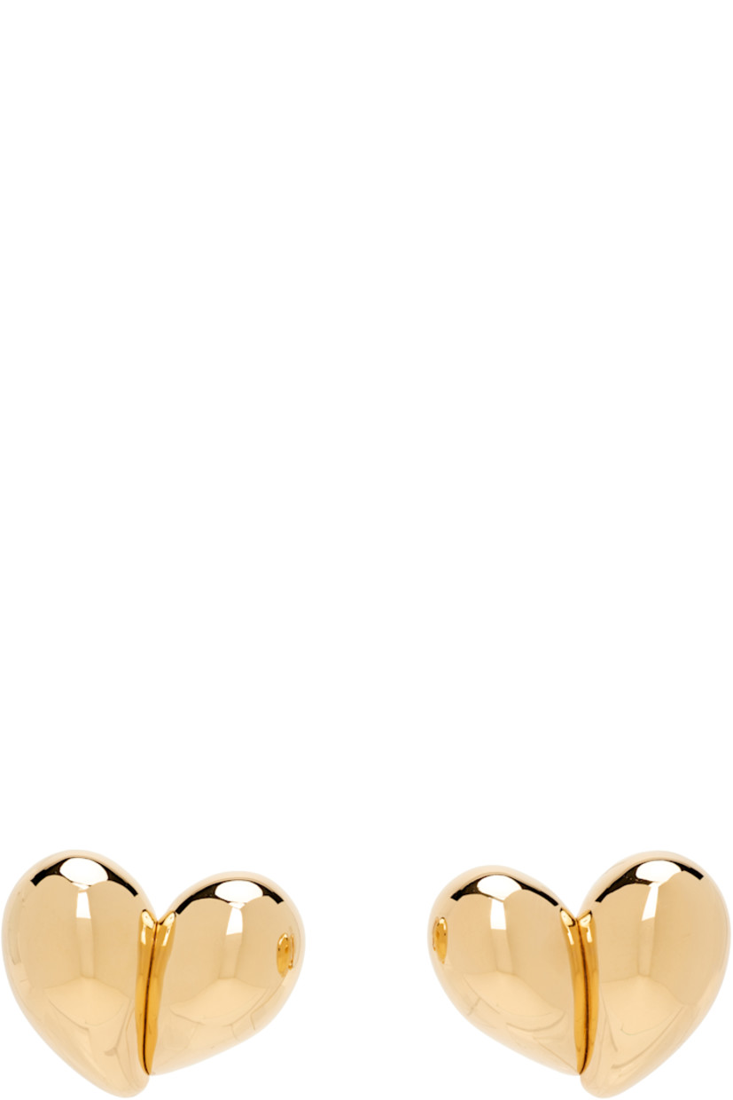Pair of drop earrings in 18k yellow gold-plated sterling silver.

· Graphic at face
· Clip-on fastening
· H1" x W1.25"

Supplier color: Yellow gold