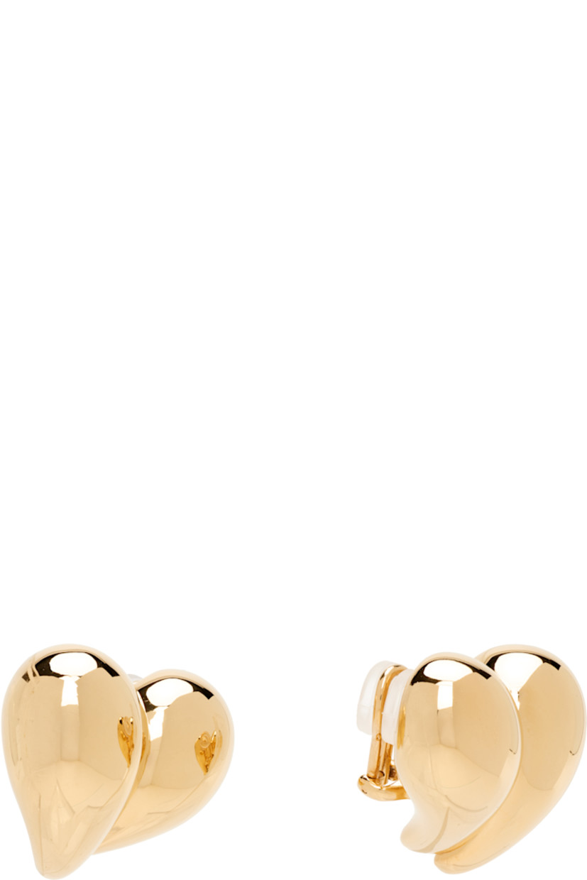 Pair of drop earrings in 18k yellow gold-plated sterling silver.

· Graphic at face
· Clip-on fastening
· H1" x W1.25"

Supplier color: Yellow gold