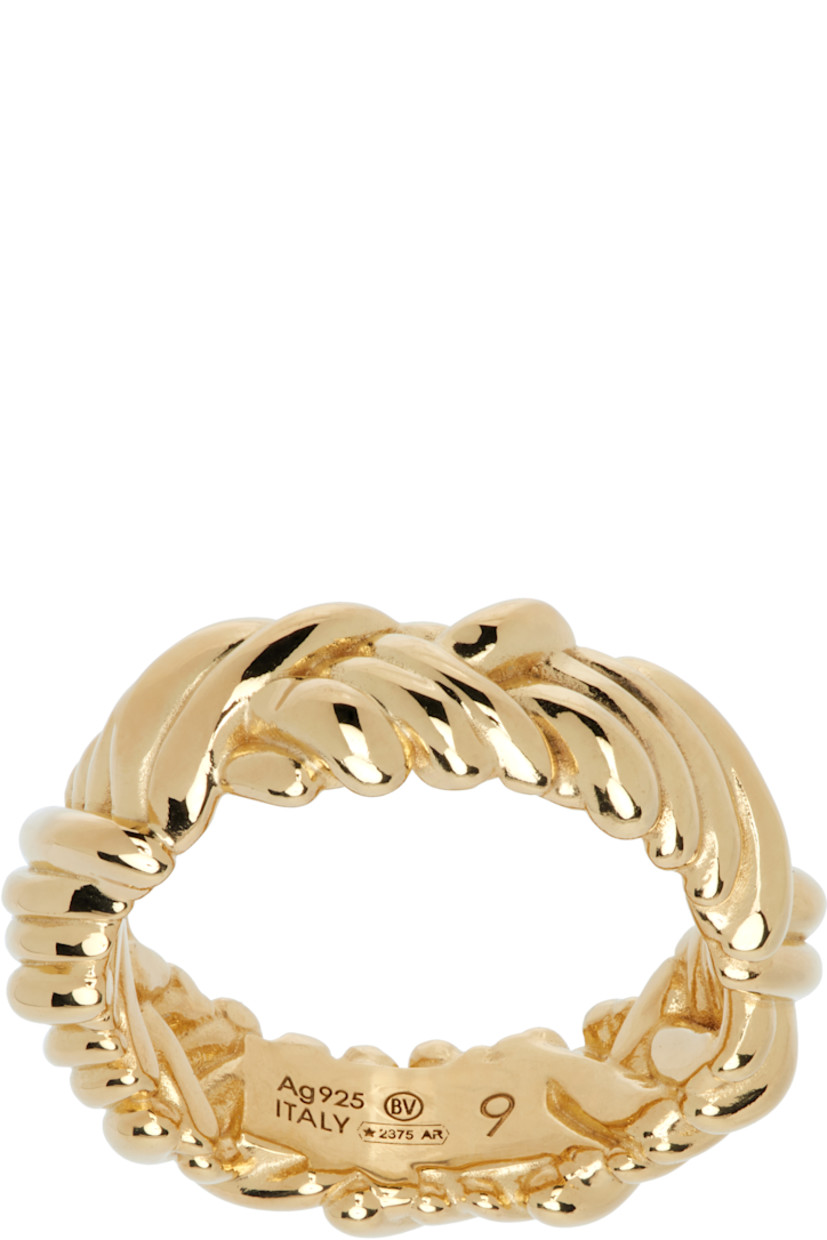 Hand-polished band ring in 18k gold-plated sterling silver. 

· Engraved intreccio pattern throughout
· Logo and hallmarking at inner band

Supplier color: Yellow gold