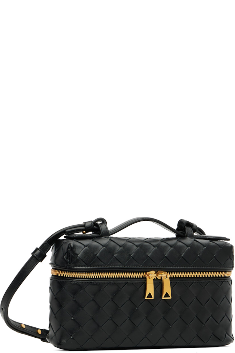 Intrecciato-woven grained calfskin messenger bag.

· Fixed carry handle
· Adjustable and detachable crossbody strap
· Two-way zip closure
· Card slot at interior
· H5" x W9" x D2.5"

Supplier color: Black
