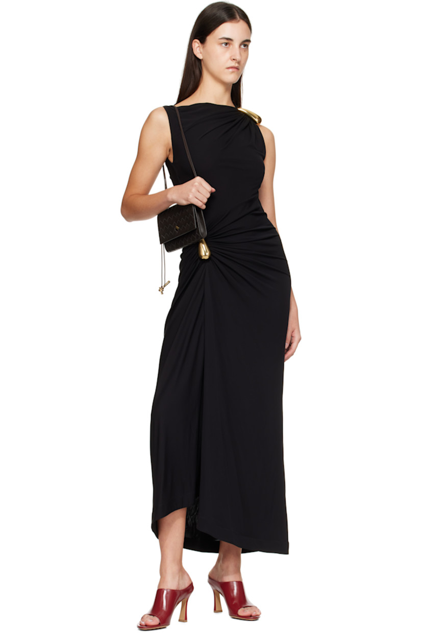 Intrecciato-woven lambskin shoulder bag.

· Sliding cord shoulder strap
· Knot hardware at tab-slot flap
· Card slots at calfskin interior
· Gold-tone hardware
· H5" x W7.5" x D1"

Supplier color: Fondant