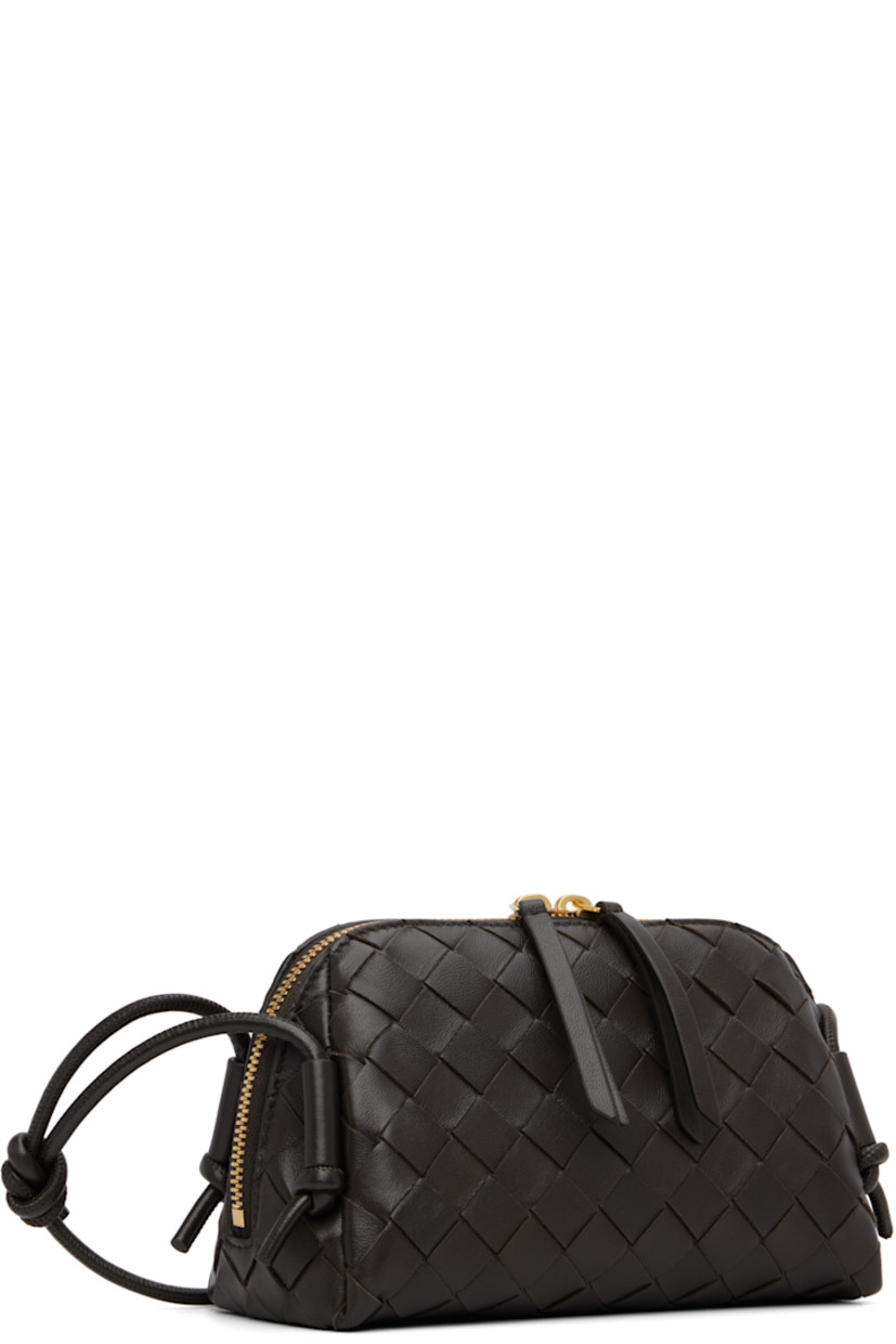 Intrecciato-woven lambskin shoulder bag.

· Knotted crossbody strap
· Two-way zip closure
· Patch pocket at calfskin interior
· H4.75" x W7" x D3.5"

Supplier color: Fondant