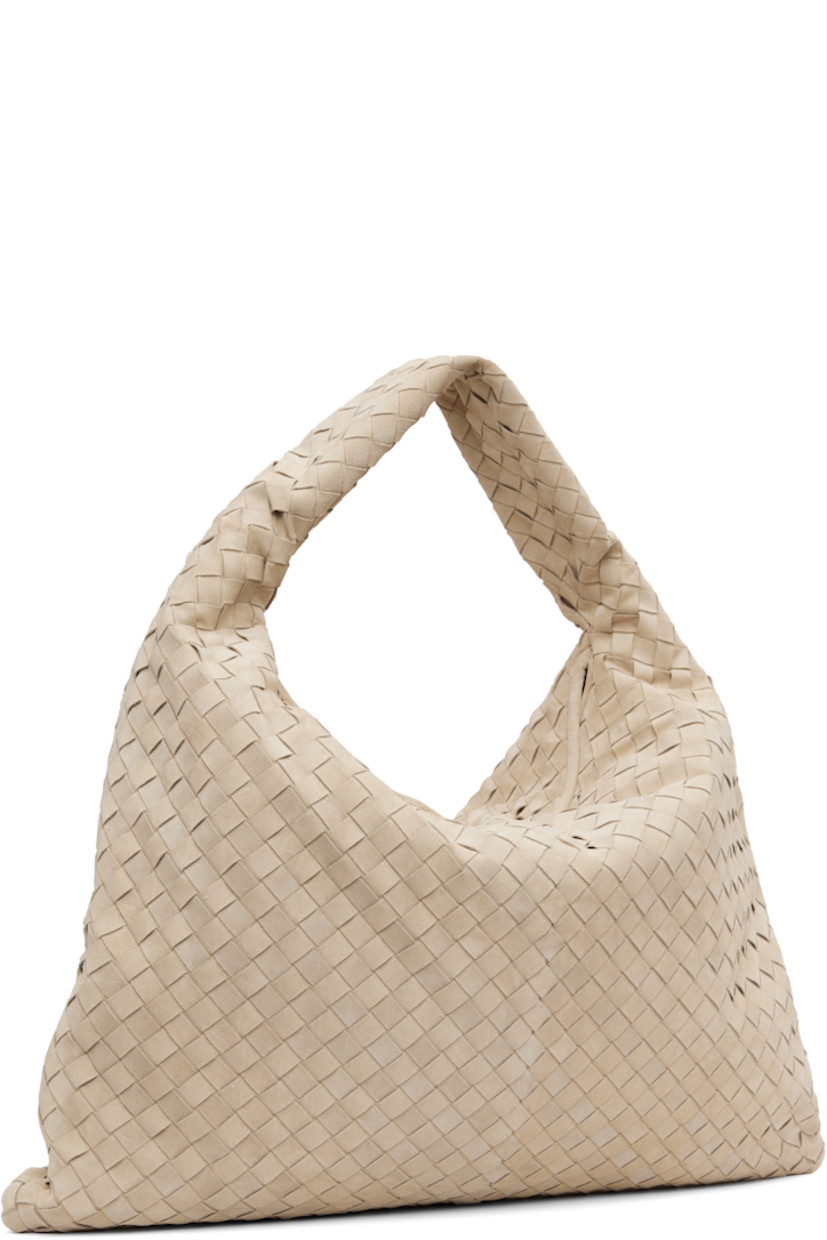Intrecciato-woven calfskin suede shoulder bag.

· Integrated shoulder strap
· Magnetic foldover flap
· Zip pocket at interior
· H16" x W21.5 x D2" 

Supplier color: Ecru