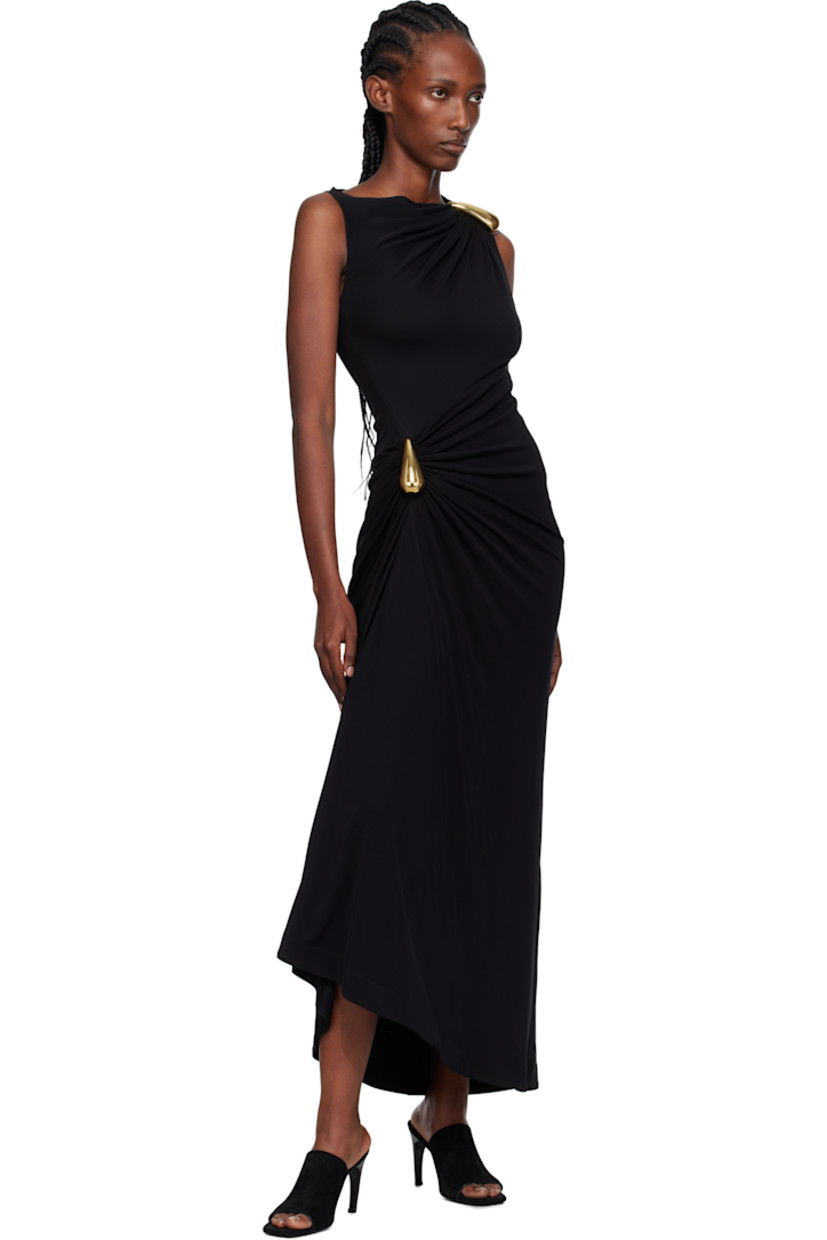Viscose crêpe jersey maxi dress.

· Draping throughout
· Boatneck
· Sculptural hardware at waist and shoulder
· Asymmetrical hem
· Concealed zip closure at side

Supplier color: Black
