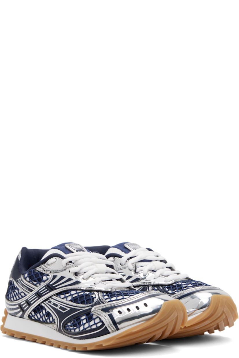 Low-top patent calfskin and mesh sneakers.

· Lace-up closure
· Logo patch at padded tongue
· Padded collar
· Logo printed at outer side
· Mesh lining
· Foam rubber midsole
· Treaded rubber sole

Supplier color: Abyss/Silver