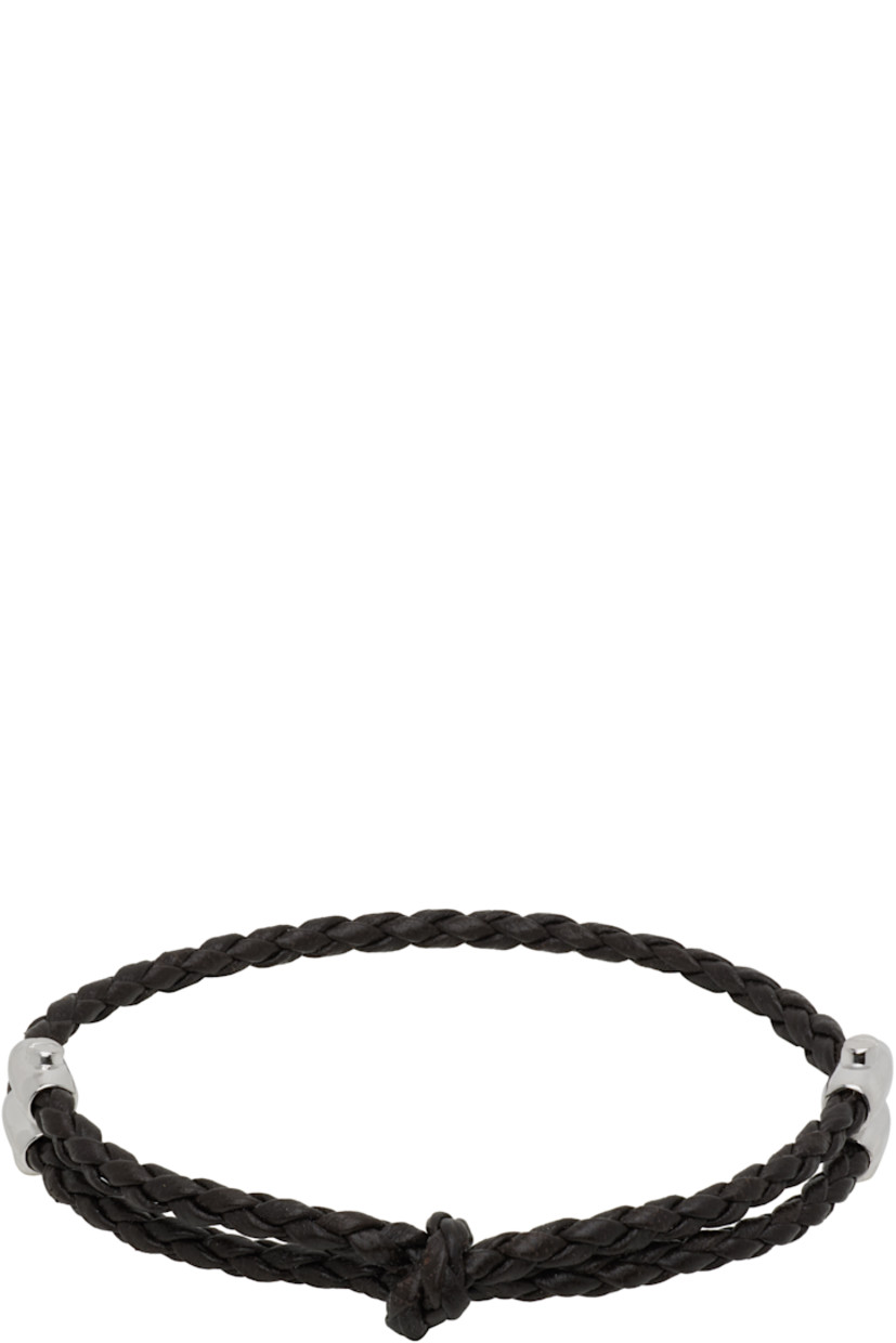 Braided buffed nappa leather bracelet in brown. 

· Knot at face 
· Pull-through fastening 
�· Sterling silver hardware 

Supplier color: Fondant