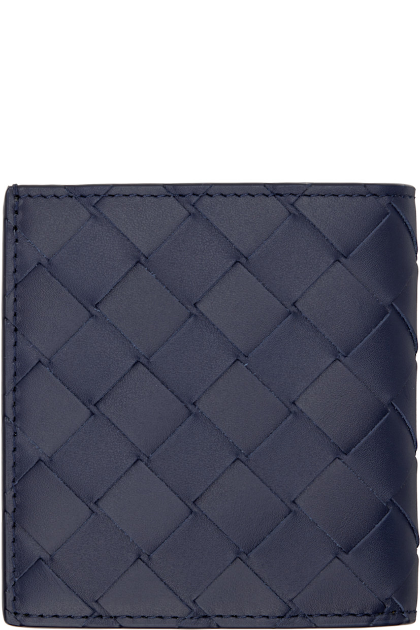 Intrecciato-woven grained calfskin bifold wallet.

· Six card slots and single note slot
· Two patch pockets
· Textile and calfskin lining in green
· H4" x W3.75"

Supplier color: Abyss/cypress