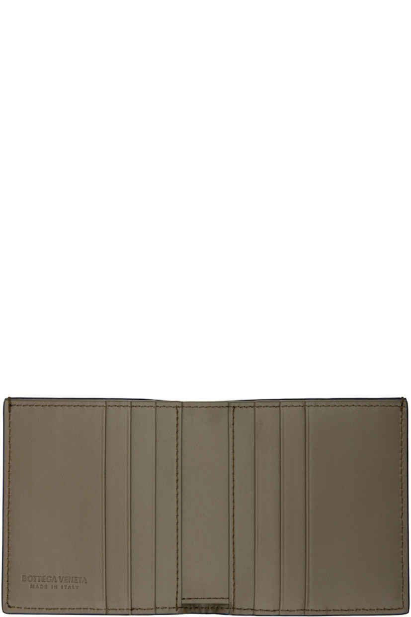 Intrecciato-woven grained calfskin bifold wallet.

· Six card slots and single note slot
· Two patch pockets
· Textile and calfskin lining in green
· H4" x W3.75"

Supplier color: Abyss/cypress