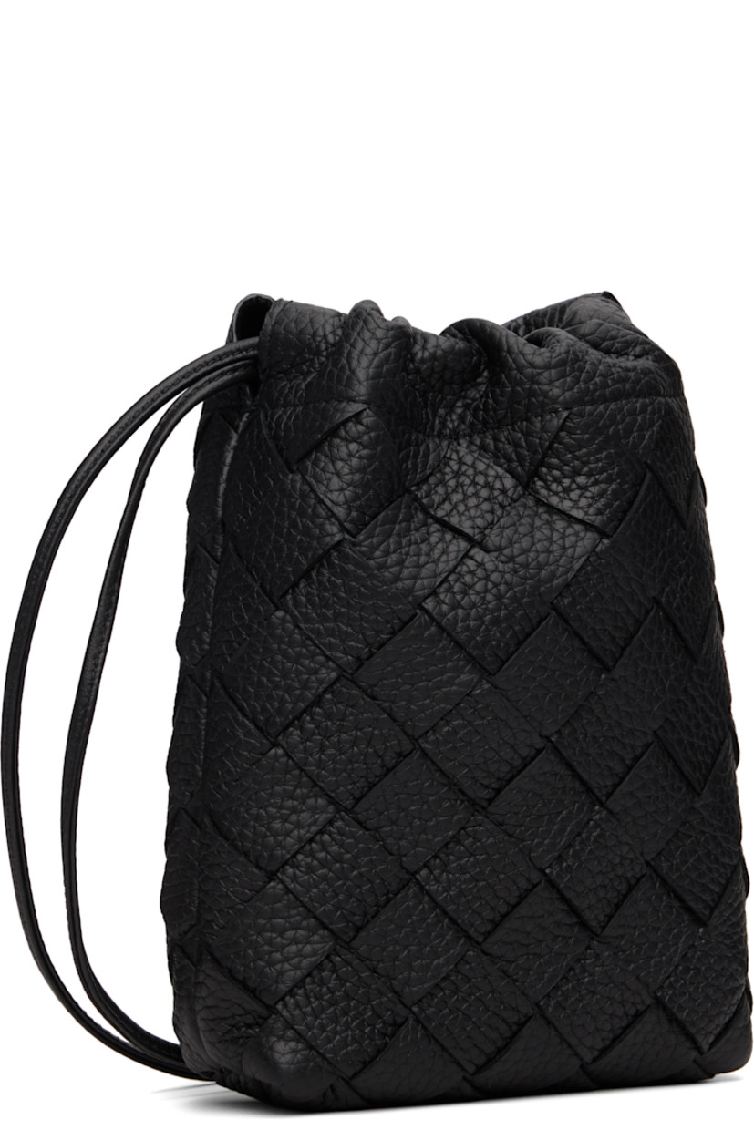 Intrecciato-woven grained calfskin pouch.

· Twin shoulder straps
· Connecting tab at straps for crossbody styling
· Drawstring closure
· Nylon taffeta lining
· H7" x W5.5" x D2"

Supplier color: Black