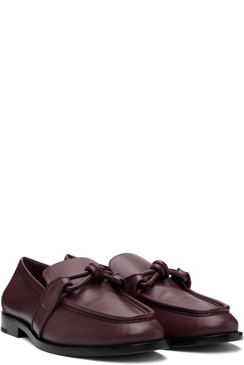 Buffed calfskin loafers.

· Moc toe
· Knotted strap at vamp
· Stacked leather heel with rubber injection
· Leather sole

Supplier color: Baralo