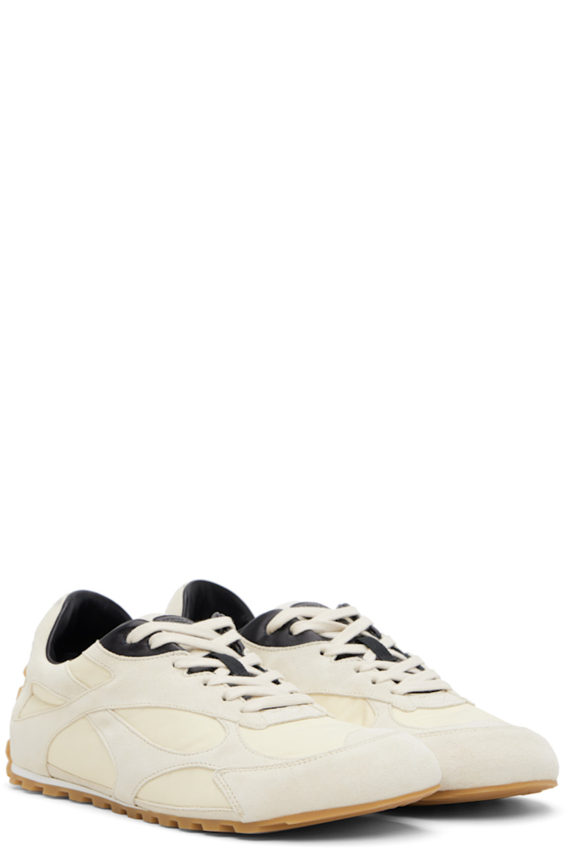Low-top suede and nylon taffeta sneakers.

· Lace-up closure
· Logo patch at padded tongue
· Padded collar
· Logo embossed at heel tab
· Buffed lambskin lining
· Treaded rubber sole

Supplier color: Sea salt/Black