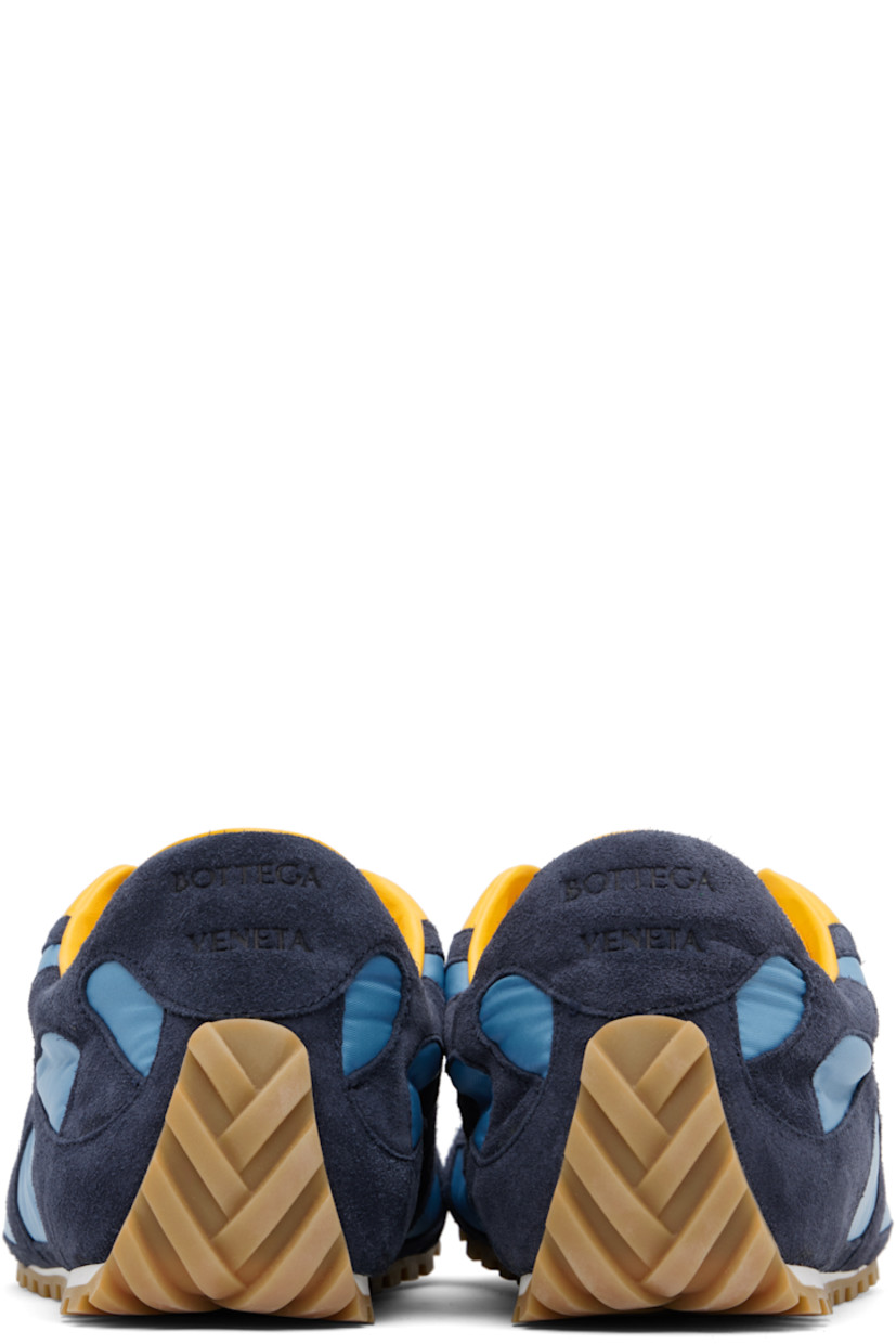 Low-top suede and nylon taffeta sneakers.

· Lace-up closure
· Logo patch at padded tongue
· Padded collar
· Logo embossed at heel tab
· Buffed lambskin lining
· Treaded rubber sole

Supplier color: Abyss/Ice/Egg yolk