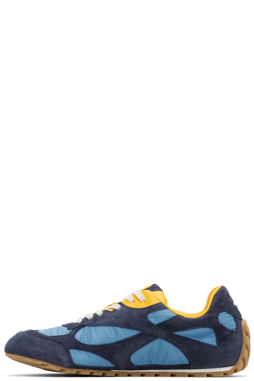Low-top suede and nylon taffeta sneakers.

· Lace-up closure
· Logo patch at padded tongue
· Padded collar
· Logo embossed at heel tab
· Buffed lambskin lining
· Treaded rubber sole

Supplier color: Abyss/Ice/Egg yolk
