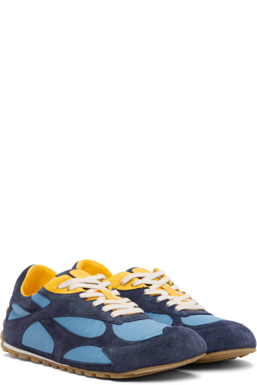 Low-top suede and nylon taffeta sneakers.

· Lace-up closure
· Logo patch at padded tongue
· Padded collar
· Logo embossed at heel tab
· Buffed lambskin lining
· Treaded rubber sole

Supplier color: Abyss/Ice/Egg yolk