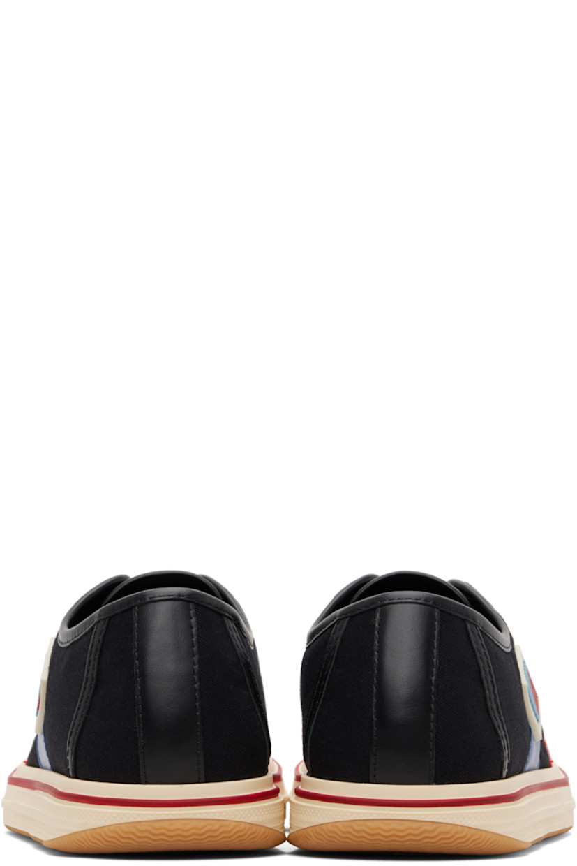 Low-top canvas and buffed leather sneakers.

· Rubber cap toe
· Lace-up closure
· Logo hardware at tongue
· Rubberized logo patch at outer side
· Metal eyelets at inner side
· Treaded rubber sole

Supplier color: Black