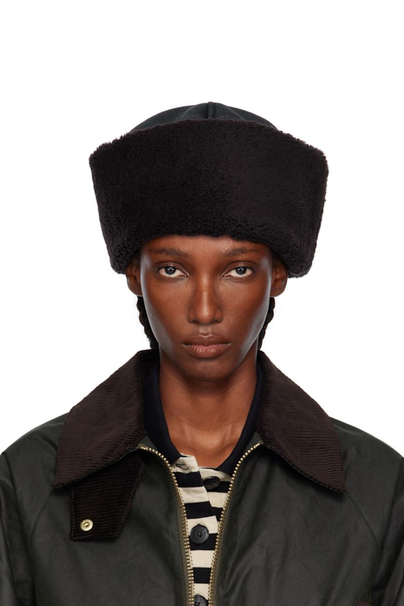 Grained lambskin hat. Shearling rolled brim and interior.

Supplier color: Dark brown aviator shearling