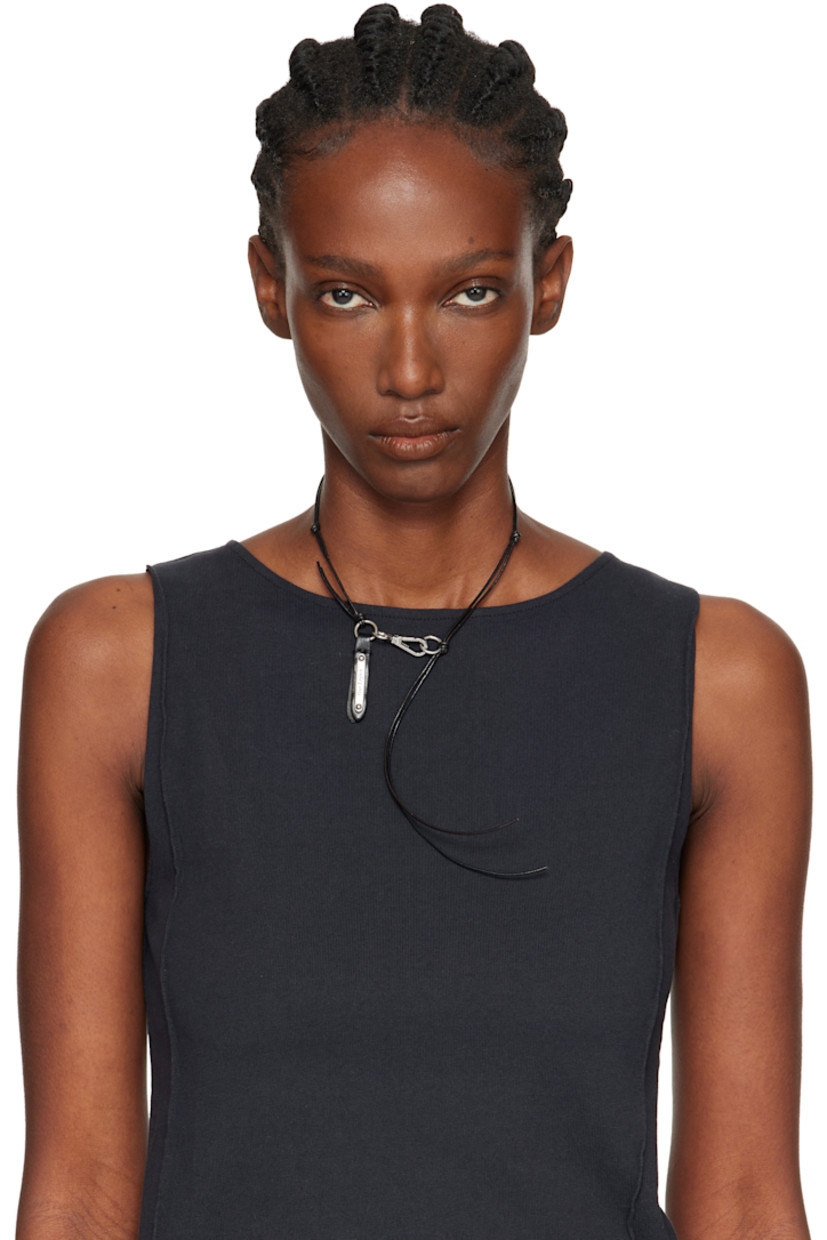 Grained leather cord choker in black. 

· Logo plaque at leather tab 
· Lanyard-clasp fastening 
· Silver-tone hardware
· L16"

Supplier color: Fudge liquorice leather