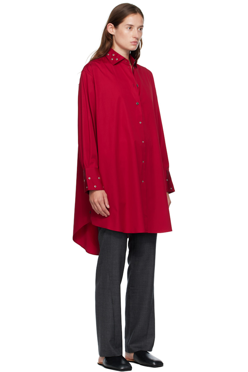 Cotton poplin midi dress.

· Grommets throughout 
· Spread collar 
· Button closure
· Shirttail hem
· Buttoned vent at side seams
· Buttoned barrel cuffs
· Mother-of-pearl hardware

Supplier color: Lipstick red super poplin