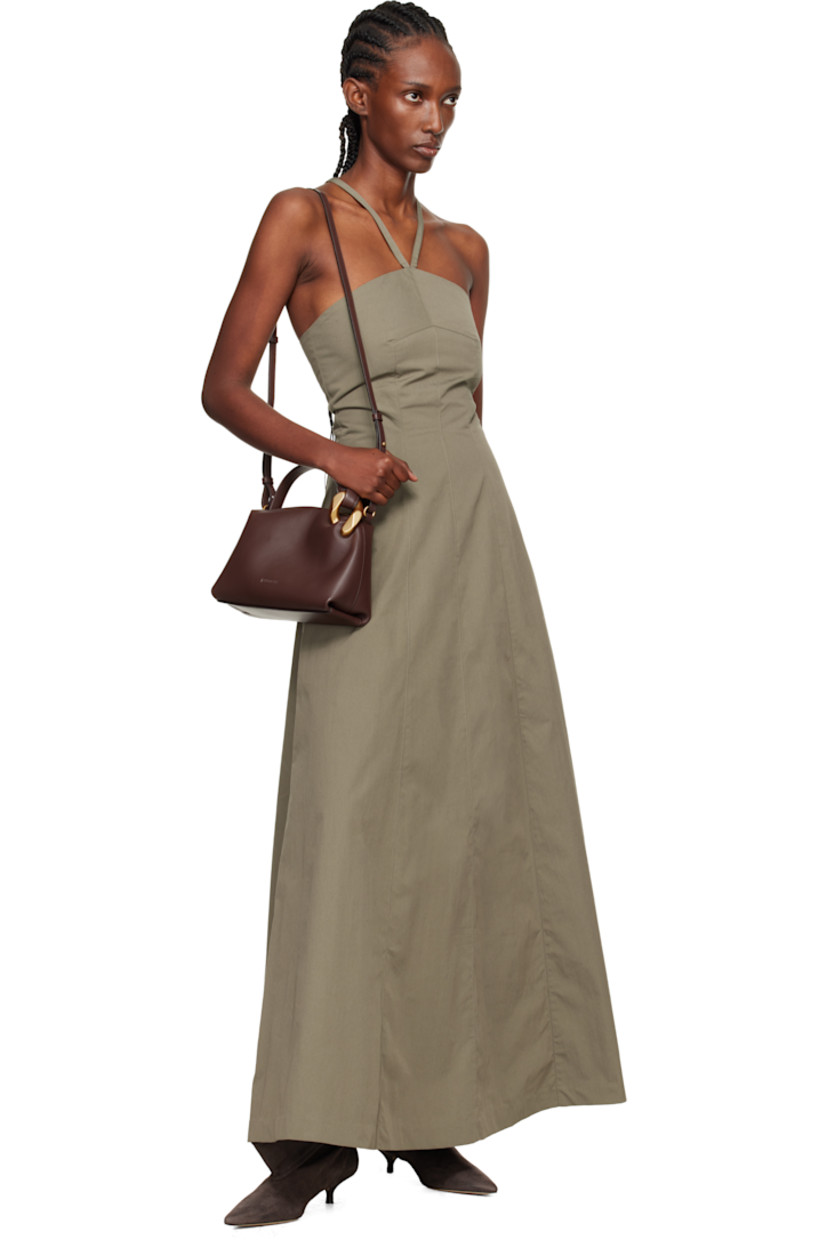 Cotton- and nylon-blend taffeta maxi dress.

· Subtle brown-to-red iridescent solaro-style coloration
· Halter strap at straight neck
· Lace-up closure at low back
· Full twill lining 

Supplier color: Solaro safe tide cotton nylon