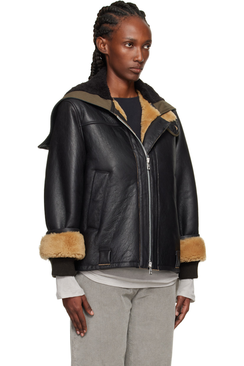 Grained lambskin jacket. 

· Zip vent at hood
· Throat guard at stand collar 
· Two-way zip closure 
· Welt pockets and belt loops at waist
· Inset rib-knit cuffs
· Cattle horn hardware

Supplier color: Natural aviator shearling
