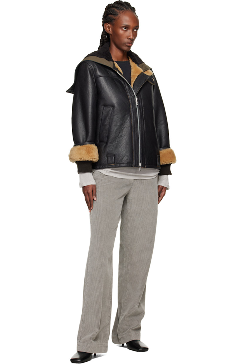 Grained lambskin jacket. 

· Zip vent at hood
· Throat guard at stand collar 
· Two-way zip closure 
· Welt pockets and belt loops at waist
· Inset rib-knit cuffs
· Cattle horn hardware

Supplier color: Natural aviator shearling
