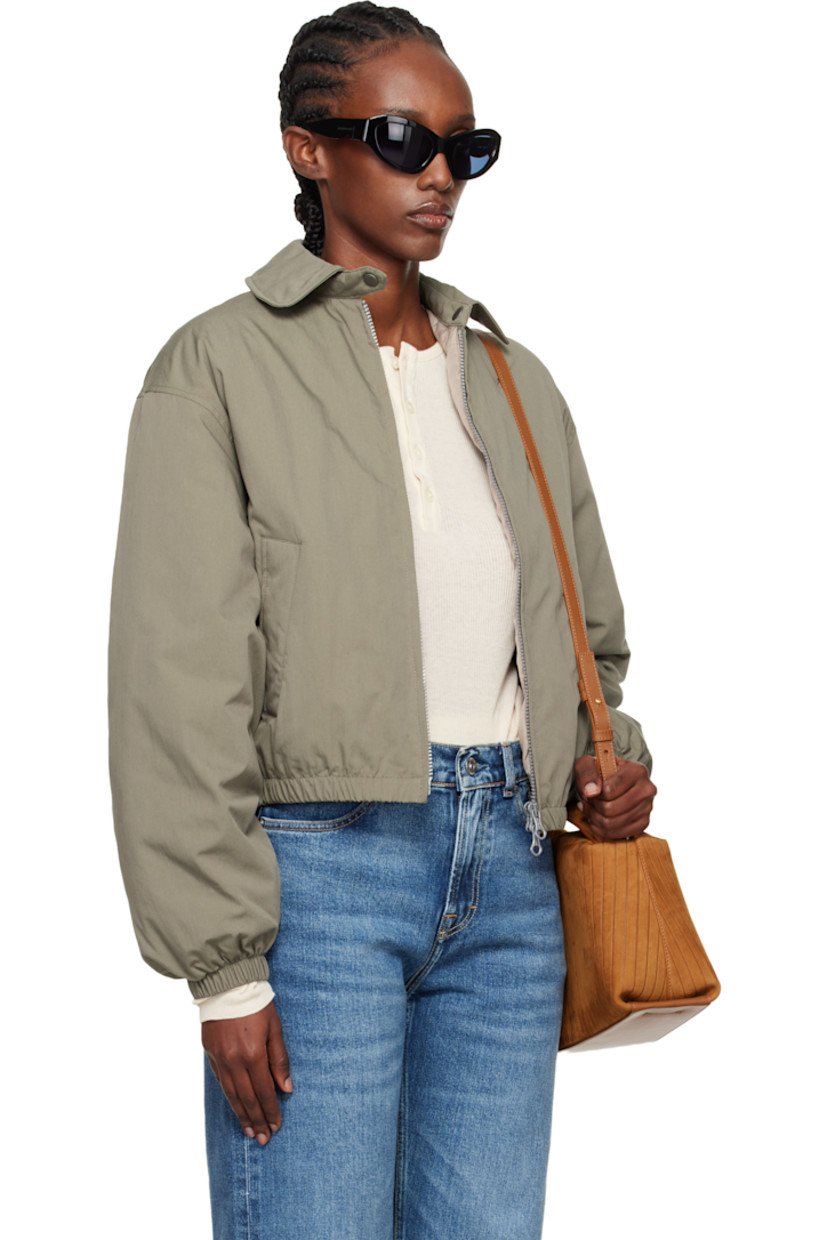 Insulated cotton- and nylon-blend taffeta jacket.

· Subtle brown-to-red iridescent solaro-style coloration
· Press-stud throat guard at spread collar
· Two-way zip closure
· Welt pockets at front
· Elasticized hem and cuffs
· Cropped hem
· Zip pocket at interior
· Full quilted satin lining

Supplier color: Solaro safe tide cotton nylon