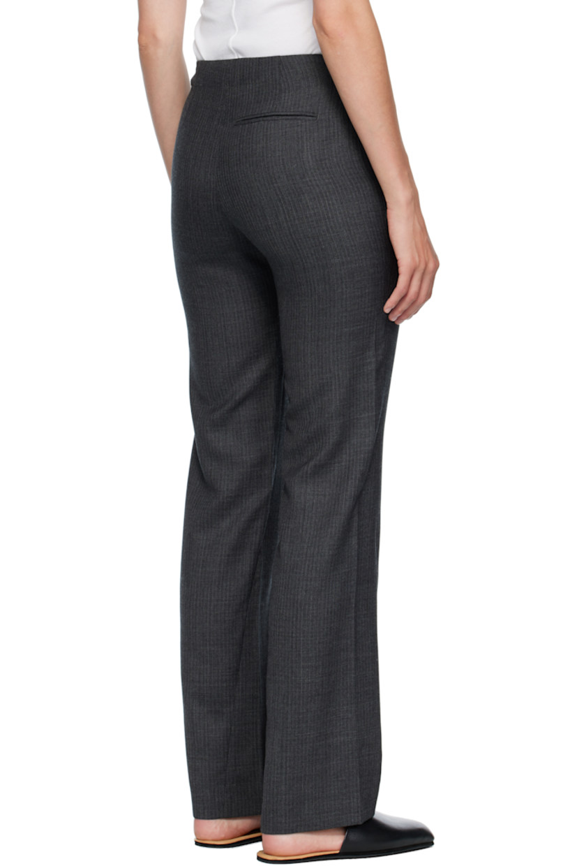 Straight-leg virgin wool herringbone trousers.

· Low-rise
· Three-pocket styling
· Zip fly
· Twisted outseams
· Darts at back waist

Supplier color: Smoke grey micro herringbone