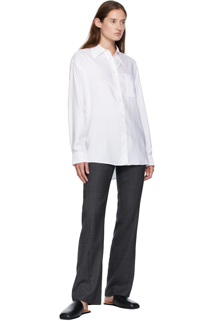 Straight-leg virgin wool herringbone trousers.

· Low-rise
· Three-pocket styling
· Zip fly
· Twisted outseams
· Darts at back waist

Supplier color: Smoke grey micro herringbone