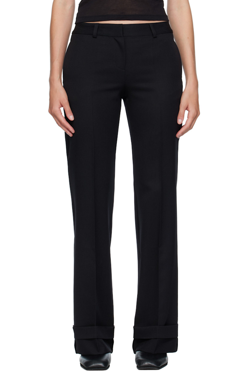 Virgin wool gabardine trousers.

· Straight-leg 
· Low-rise 
· Belt loops
· Four-pocket styling
· Zip fly 
· Creased legs 
· Rolled cuffs
· Horn hardware

Supplier color: Black coarse gabardine