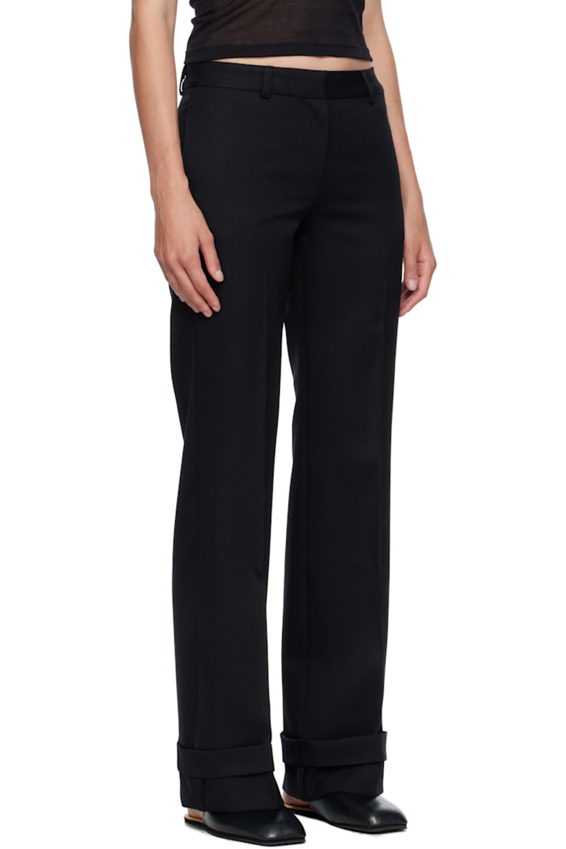 Virgin wool gabardine trousers.

· Straight-leg 
· Low-rise 
· Belt loops
· Four-pocket styling
· Zip fly 
· Creased legs 
· Rolled cuffs
· Horn hardware

Supplier color: Black coarse gabardine