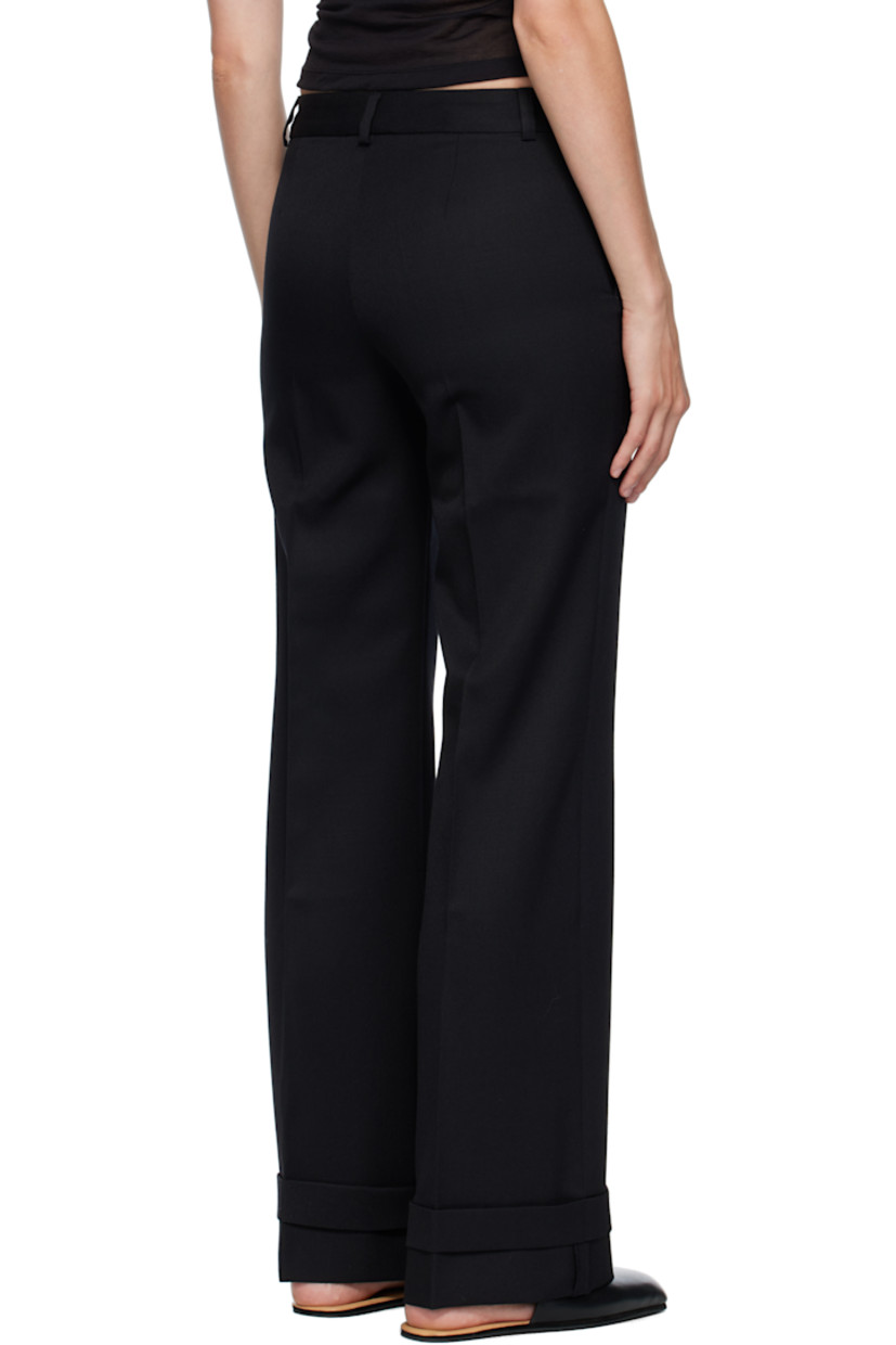 Virgin wool gabardine trousers.

· Straight-leg 
· Low-rise 
· Belt loops
· Four-pocket styling
· Zip fly 
· Creased legs 
· Rolled cuffs
· Horn hardware

Supplier color: Black coarse gabardine