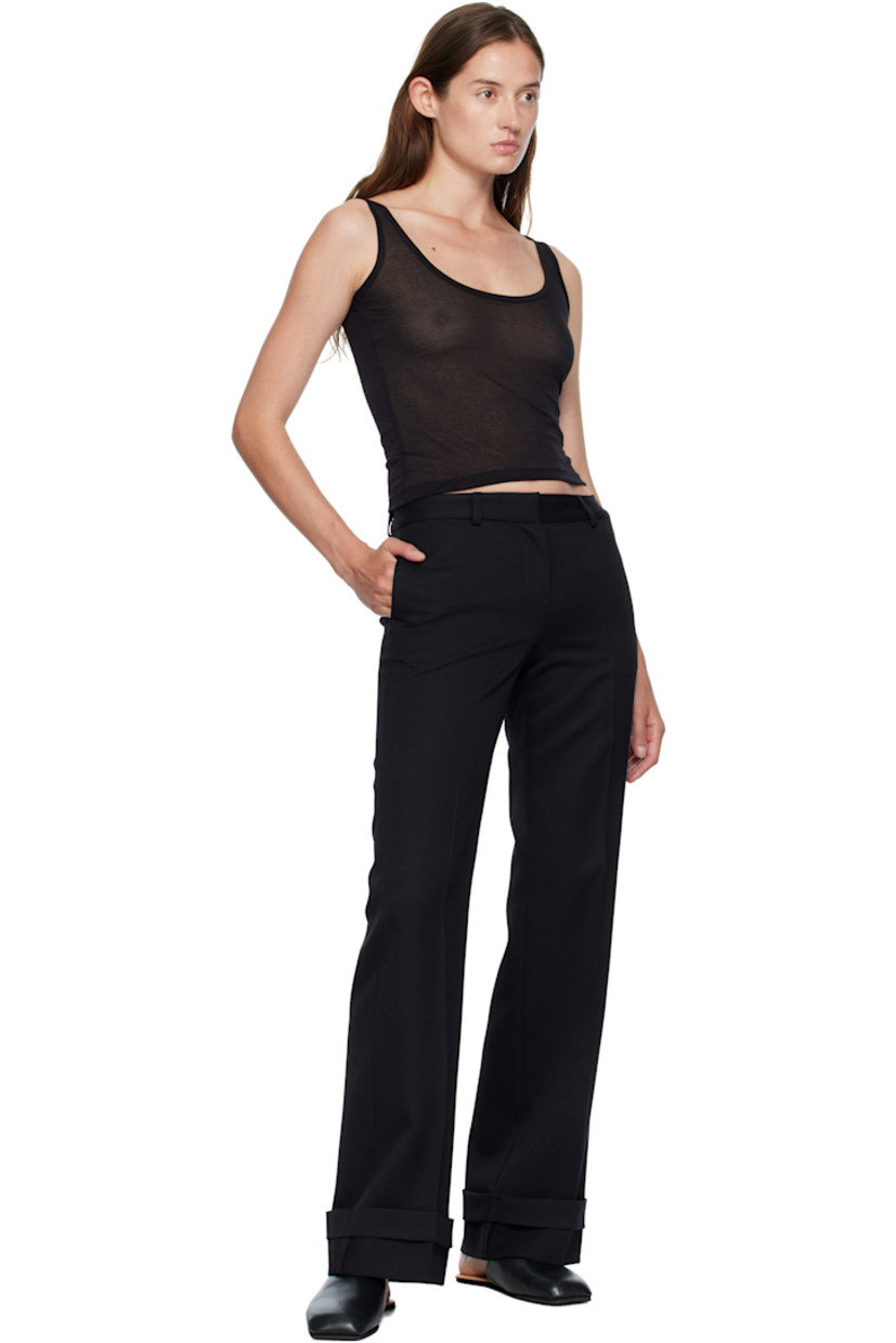 Virgin wool gabardine trousers.

· Straight-leg 
· Low-rise 
· Belt loops
· Four-pocket styling
· Zip fly 
· Creased legs 
· Rolled cuffs
· Horn hardware

Supplier color: Black coarse gabardine