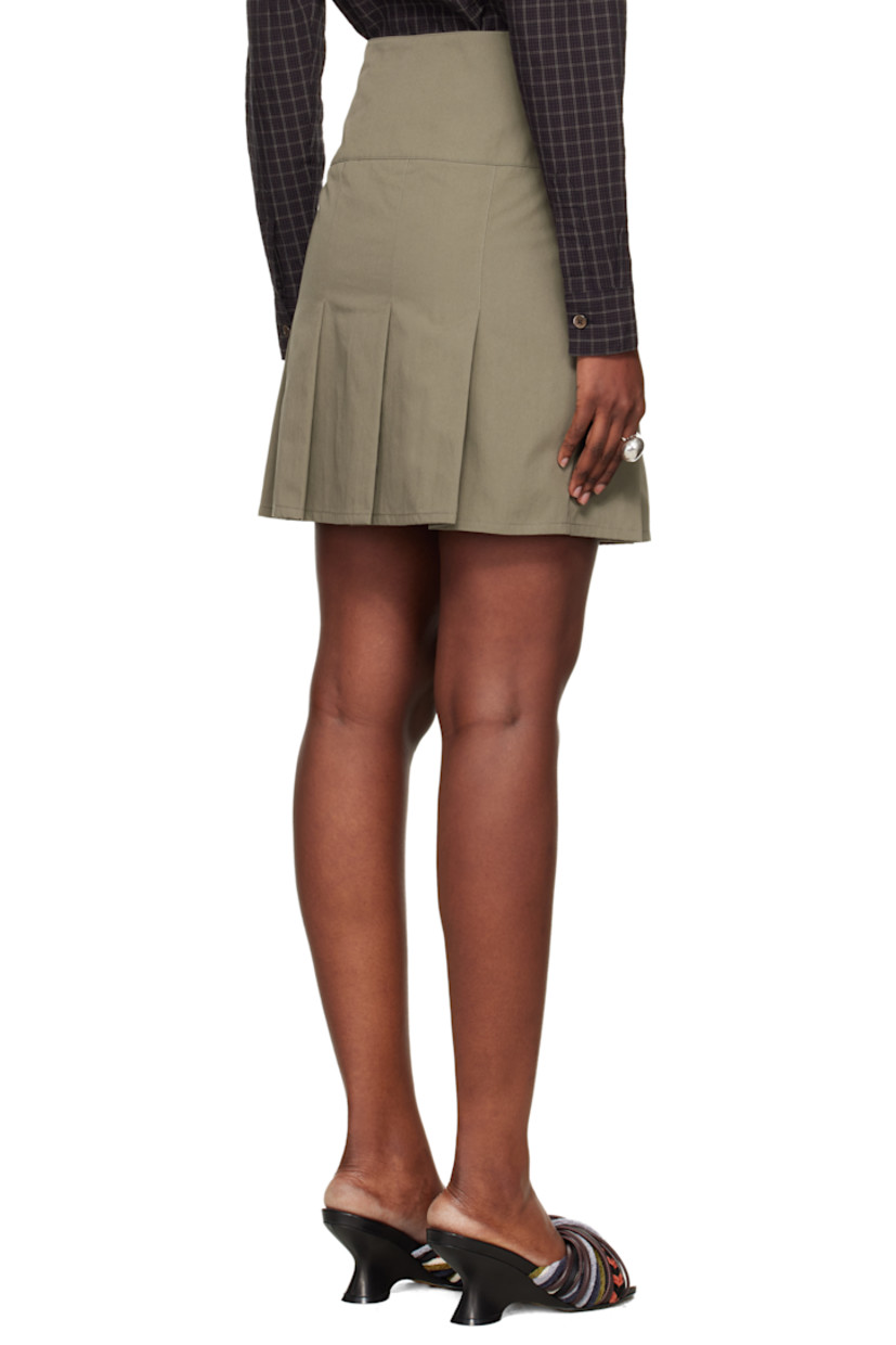 Cotton- and nylon-blend taffeta miniskirt.

· Subtle brown-to-red iridescent solaro-style coloration
· Wrap construction
· Press-stud closure
· Pleats at hem
· Full twill lining

Supplier color: Solaro safe tide cotton nylon
