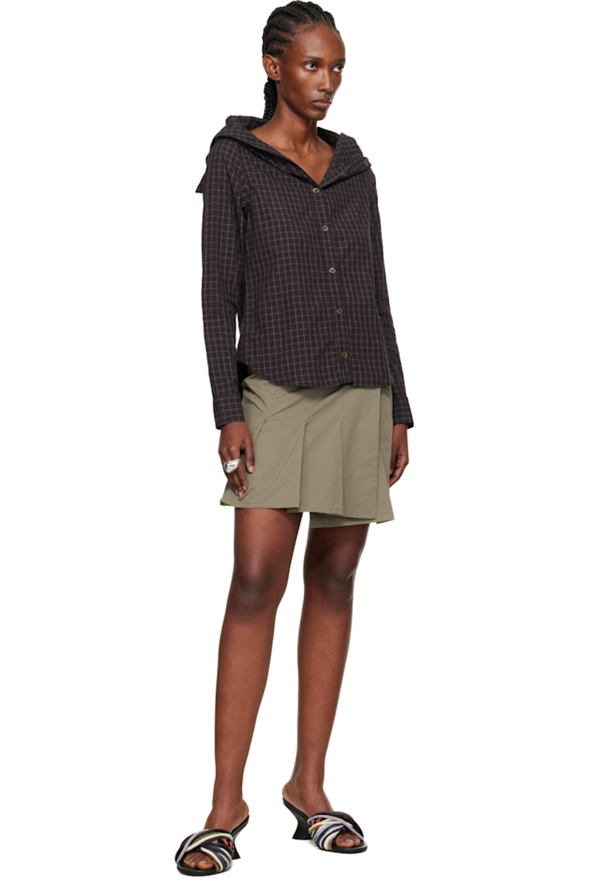 Cotton- and nylon-blend taffeta miniskirt.

· Subtle brown-to-red iridescent solaro-style coloration
· Wrap construction
· Press-stud closure
· Pleats at hem
· Full twill lining

Supplier color: Solaro safe tide cotton nylon
