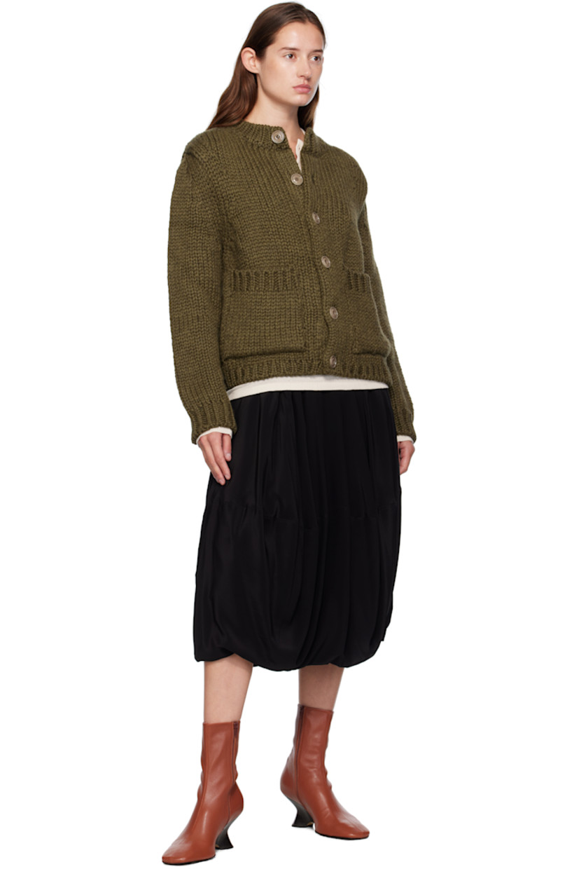 Heavyweight knit wool- and alpaca-blend cardigan.

· Rib-knit crewneck, hem, and cuffs
· Button closure
· Patch pockets at front
· Corozo hardware

Supplier color: Olive mega alpaca