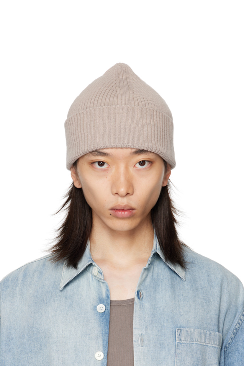 Rib-knit merino wool beanie. Rolled brim.

Supplier color: White sand rustic merino