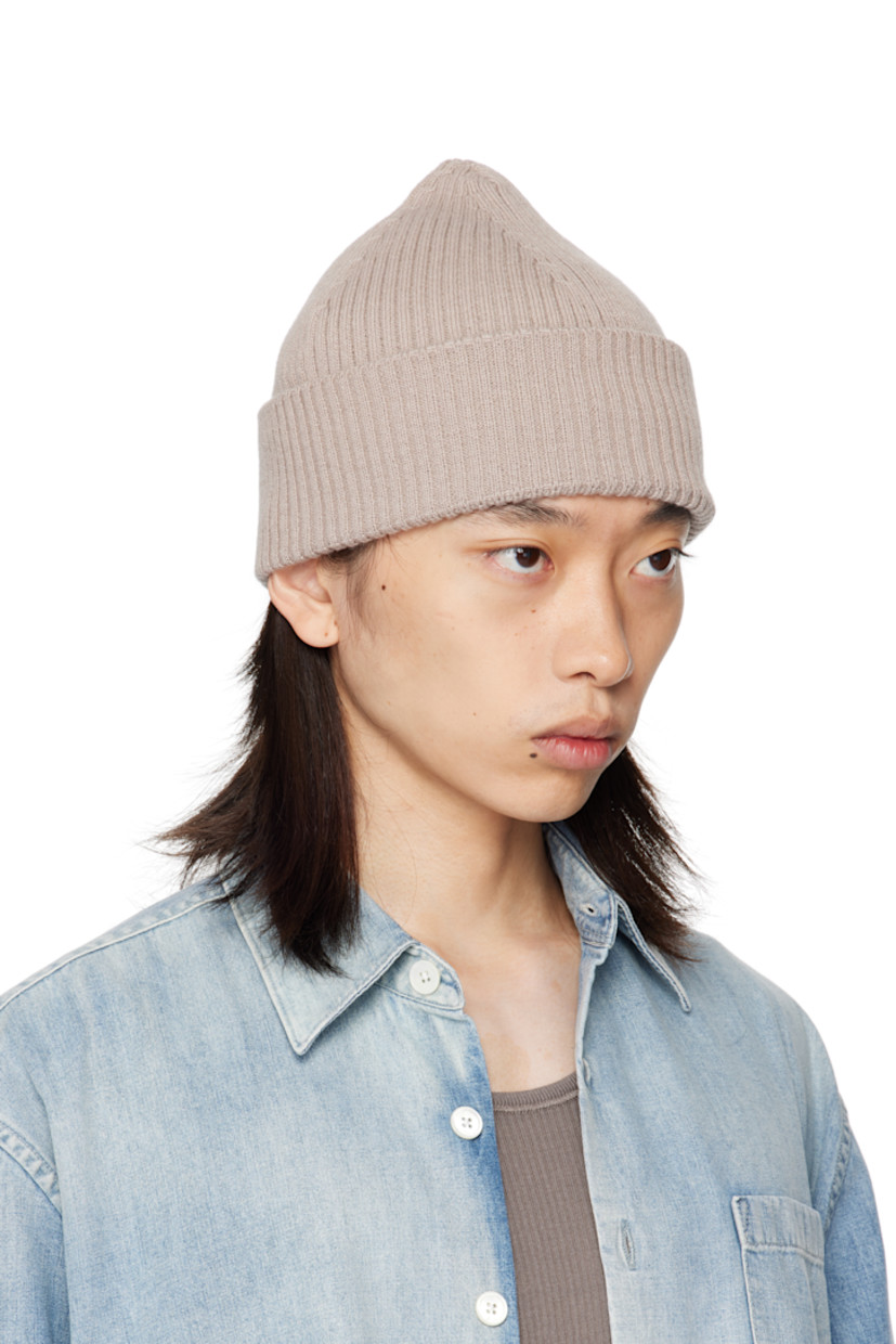Rib-knit merino wool beanie. Rolled brim.

Supplier color: White sand rustic merino