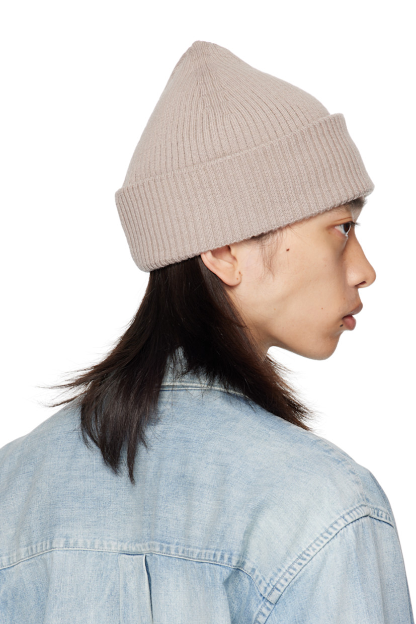 Rib-knit merino wool beanie. Rolled brim.

Supplier color: White sand rustic merino