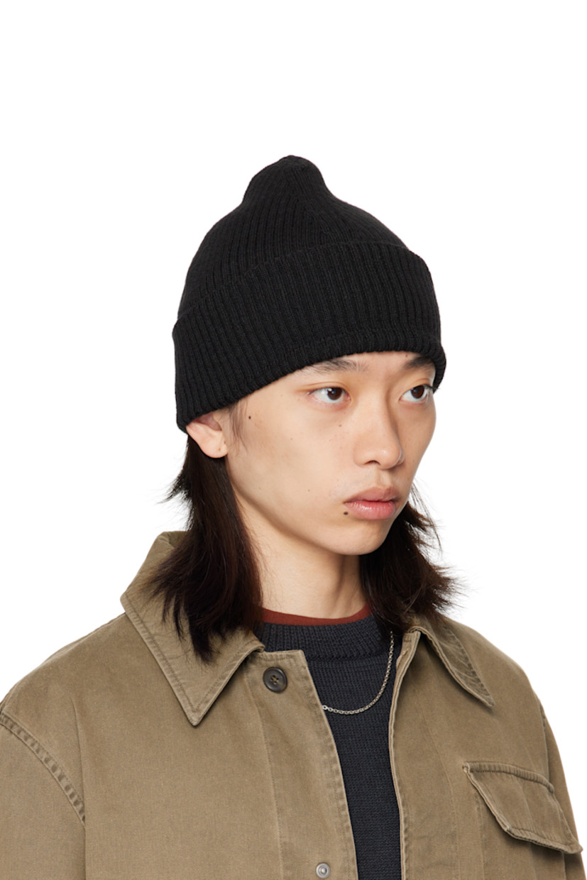 Rib-knit merino wool beanie. Rolled brim.

Supplier color: Black rustic merino