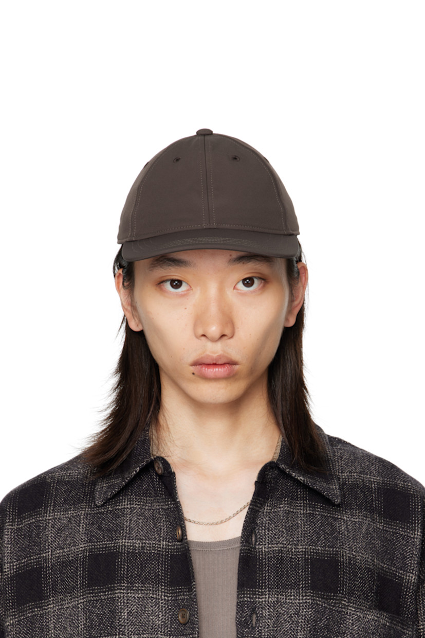 Stretch nylon taffeta cap.

· Embroidered eyelets at crown
· Curved brim
· Cinch fastening

Supplier color: Rust brown muted scuba