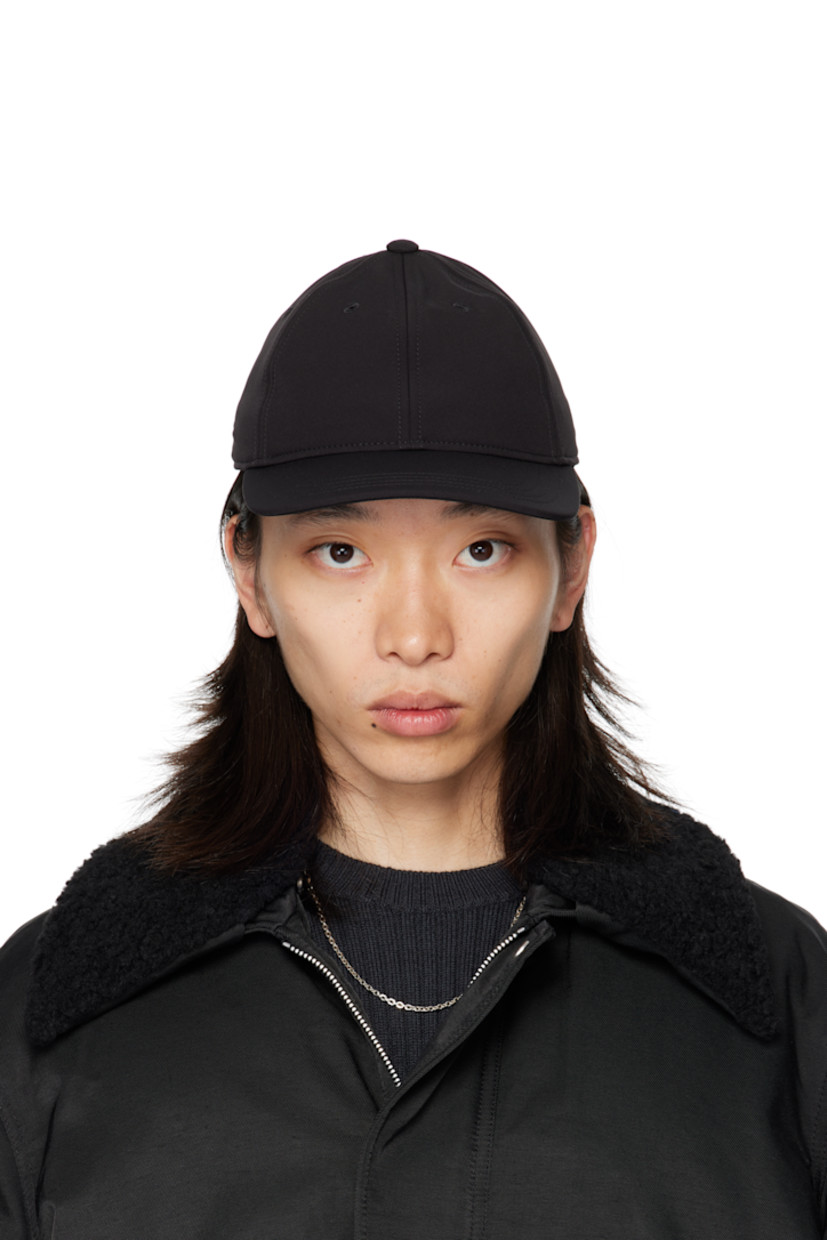 Stretch nylon taffeta cap.

· Embroidered eyelets at crown
· Curved brim
· Cinch fastening

Supplier color: Pitch black muted scuba