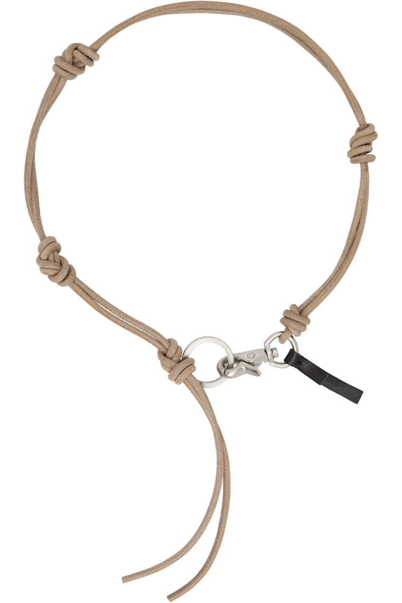 Grained leather cord necklace in black.

· Knotted detailing at length
· Logo-engraved keyring
· Hand-stitch leather logo tab at lobster-clasp fastening
· L30"

Supplier color: Natural leather