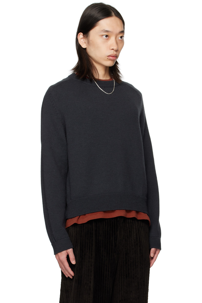 Knit wool sweater. 

· Rib-knit round neck, hem, and cuffs
· Saddle shoulders
· Drop stitch detailing at sleeves 

Supplier color: Off black rustic merino
