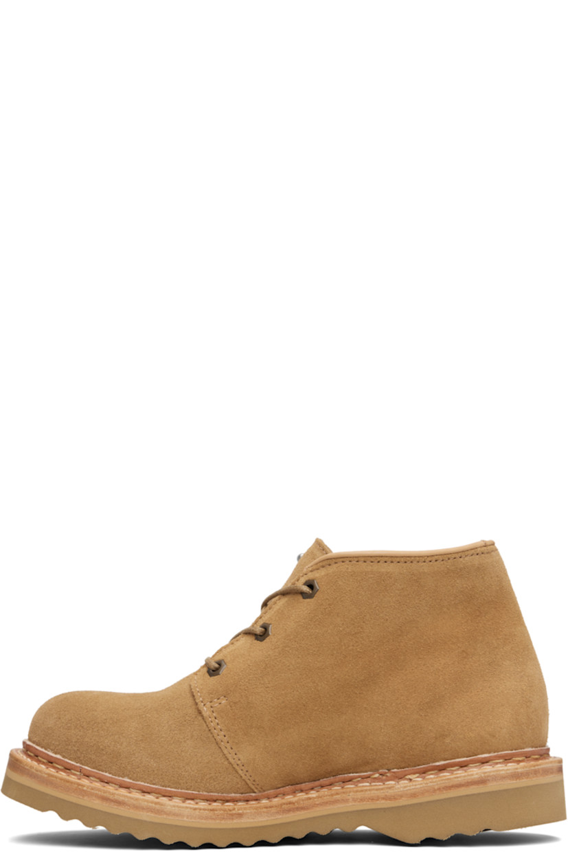 Ankle-high vegetable-tanned suede boots.

· Lace-up closure
· Logo hardware at tongue
· Buffed leather lining
· Topstitching at welt
· Foam rubber midsole
· Treaded Vibram® rubber sole

Supplier color: Medallion velour suede